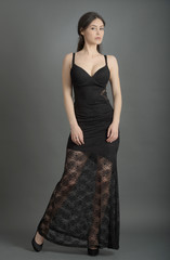 Fototapeta premium beautiful woman in elegant dress posing in studio