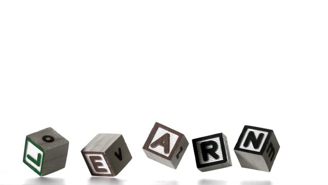 Learn spelled out in letter blocks falling over