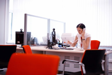  girl works at the computer manager