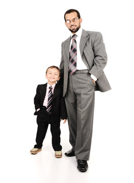 Young father and his son wearing suits