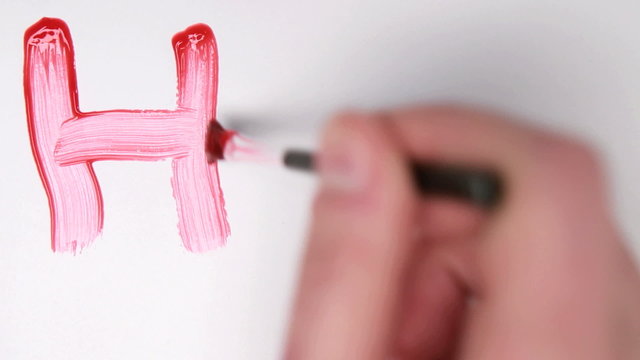 Hand painting HIV in red paint