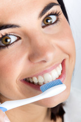 beautiful young woman picking his teeth