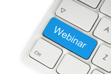 Blue webinar button on keyboard.