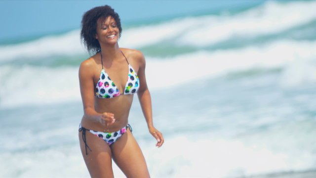 Laughing African American Girl Beach Water