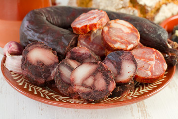 smoked sausages in the ceramic bowl