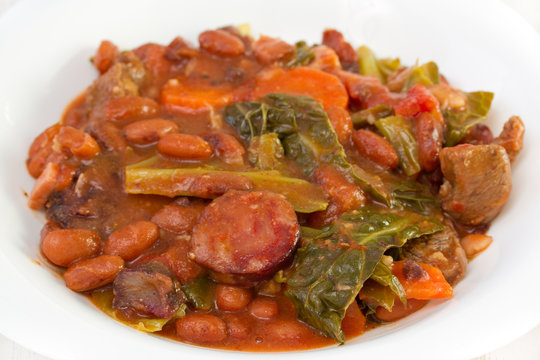 smoked sausages with carrot, beans and cabbage