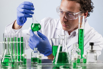 male biologist analysing green solutions