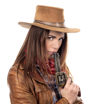 Attractive cowgirl with gun