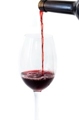 Pouring wine into a glass .