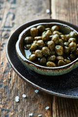 Pickled capers in a small dish
