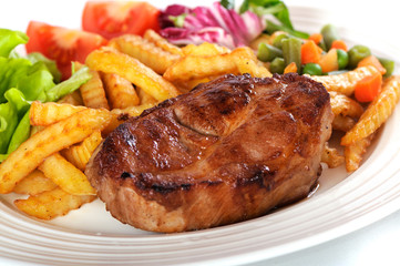 Grilled steak meat on a white plate