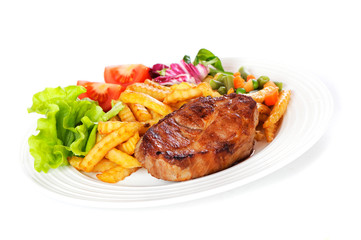 Grilled steak meat on a white plate