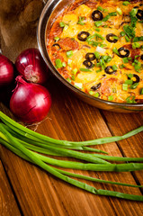 baked potato with cheese, on a wooden background