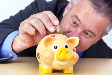 Man's money in his piggy bank
