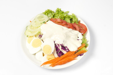 Vegetable salad isolated on white