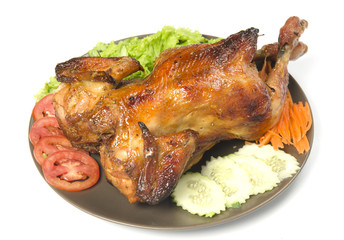 whole grilled chicken served with vegetable