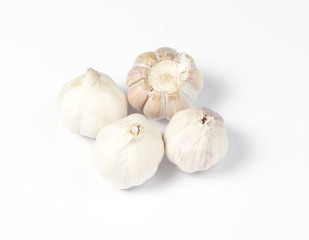 Garlic head detail isolated on white background