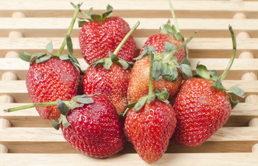 photo of delicious strawberries on wooden table background