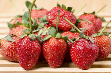 photo of delicious strawberries on wooden table background