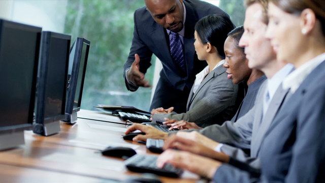 Technical Support Staff Working Computers