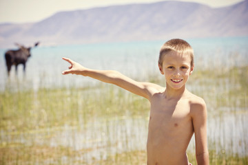 Smiling Boy having Fun at the Lake Summer Vacation