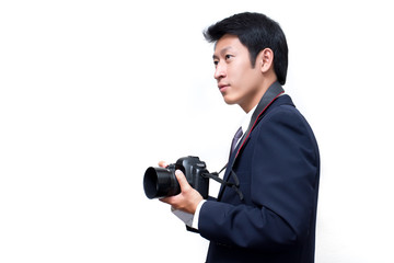 Young asian photographer taking pictures with digital camera