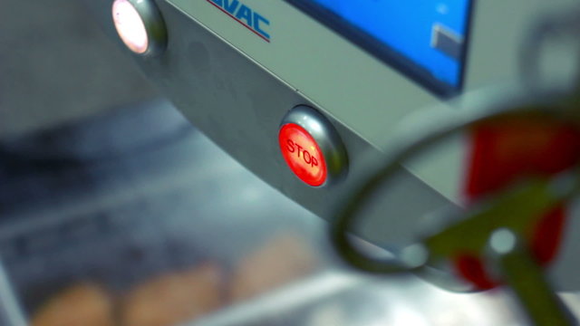 Pushing stop button turns on and off conveyor belt.