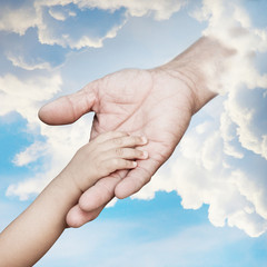 Baby hand reach out to god hand