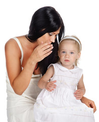 mother and daughter sharing a secret whispering. Isolated