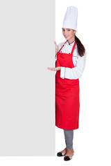 Happy Female Chef Holding Placard