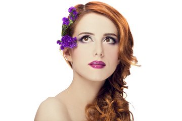 Redhead girl with flower, isolated.