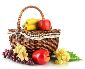 Picnic basket with fruits isolated on white