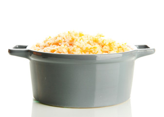 Taste rice porridge with pumpkin in saucepan, isolated on