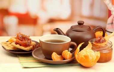 light breakfast with tea and homemade jam, on wooden table