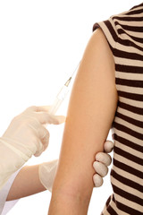 Doctor holding syringe with a vaccine in the patient shoulder,