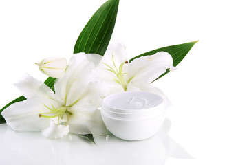 Cosmetic cream and beautiful lily, isolated on white