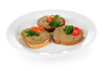 Toasted bread with pate on color plate, isolated on white