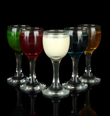 Tasty color liquors, isolated on black