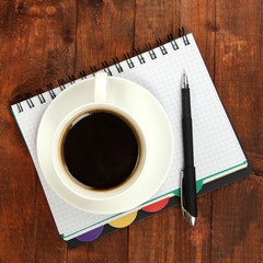 Cup of coffee on worktable close up