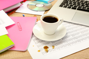 Cup of coffee on office desktop close-up