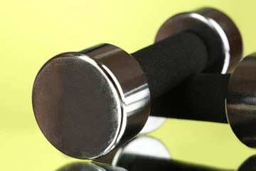 Dumbbells at 2 kg on green background
