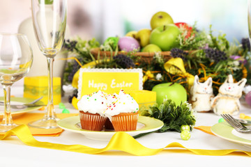 Serving Easter table on room background