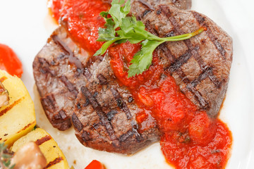 Grilled steak with baked vegetables