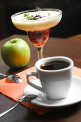 Fruit dessert and cup of coffee