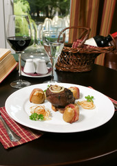 Steak with potato, place setting