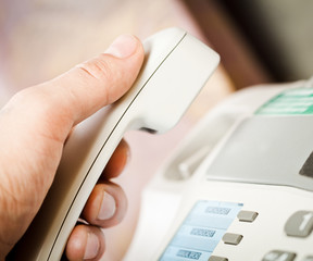 Office life, telephone receiver in hand