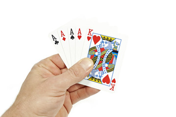 Poker player holding four of a kind