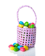 Fototapeta na wymiar Colorful candy in a purple basket