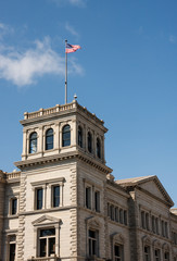 Fototapeta na wymiar Old Stone Building with American Flag