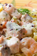 Salmon and shrimp cooked with pasta.